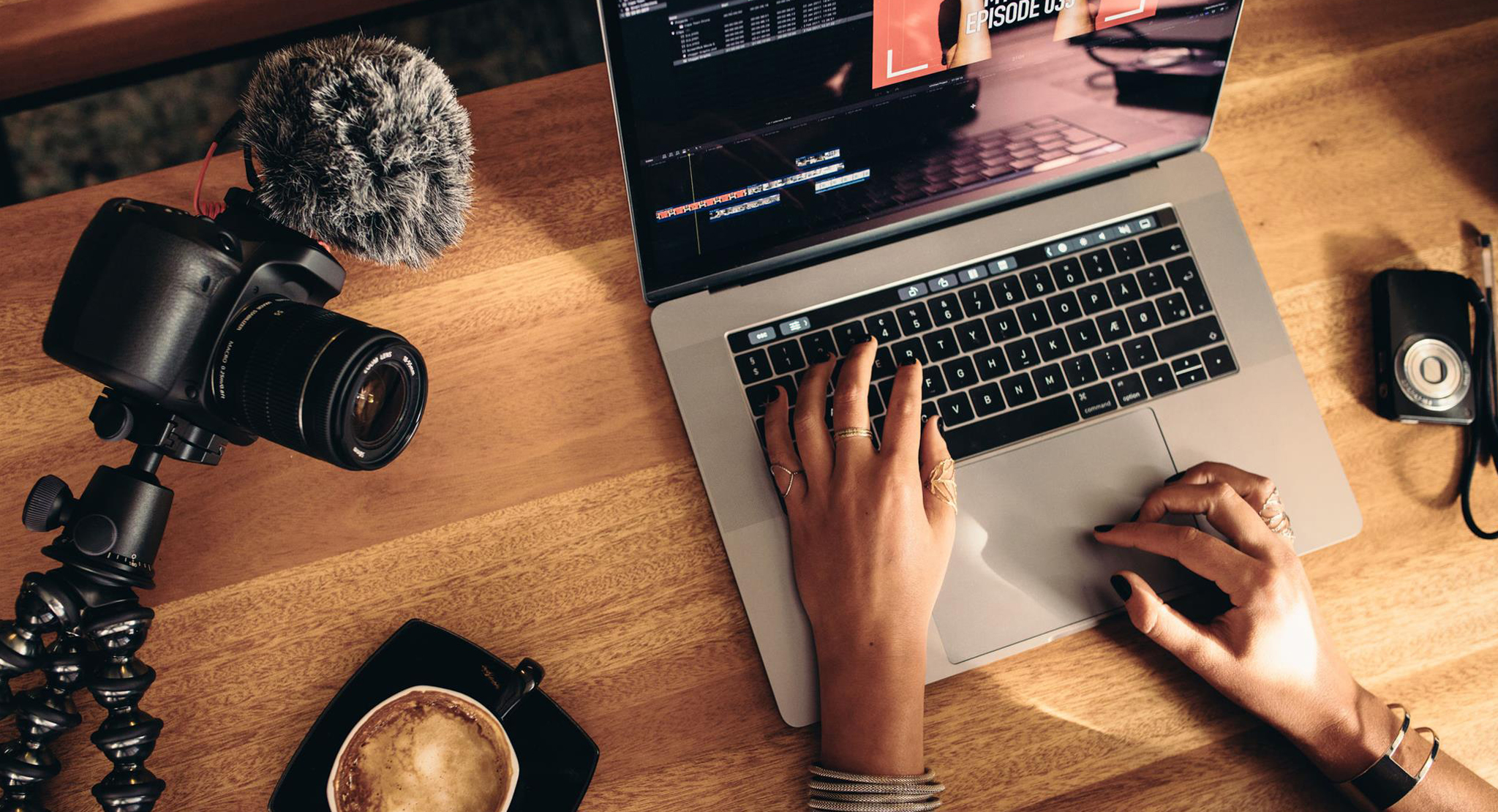 woman editing video on her laptop